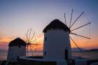 Traditional-style windmills on the coast at sunset Chora-Mykonos Island-Greece Art Print